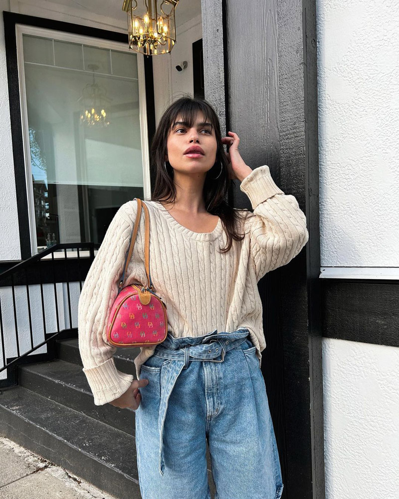 Customer @wilderfleur wearing a cream cable knit sweater tucked into paperbag-waist jeans, and a hot pink Dooney & Bourke shoulder bag Customer @wilderfleur wearing a cream cable knit sweater tucked into paperbag-waist jeans, and a hot pink Dooney & Bourke shoulder bag
